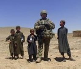Pictured here is RAF Regiment Gunner Corporal Kurt Lee posing with Afgan children whilst out on patrol during a recent tour to Afganistan. RAF Regiment Corporal Kurt Lee receives a MENTION IN DESPATCHES for his role in defending Camp Bastion against an attack by armed insurgents as a Section Commander, 14 – 15 Sep 12. Source: MoD
