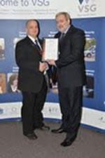Gareth Stead Clark receiving his award from the BSIA’s Trevor Elliott, Director of Manpower and Membership Services