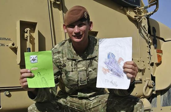 L/Cpl Andrew Barnett showing off his cards Picture source: MoD