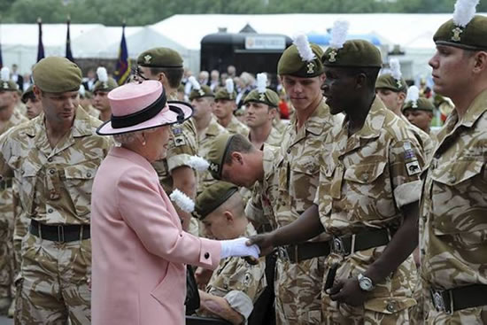 A soldier receives his medal from HM The Queen. Photo: Chris Barker/Ministry of Defence, United Kingdom.