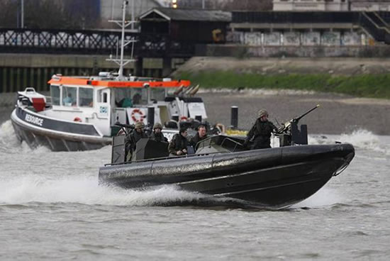 The Police and the Royal Marines conduct a security exercise on the river thames in preparation for the 2012 olympic games. Terry Seward/MoD