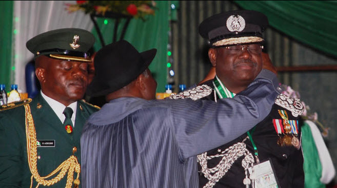 Nigeria’s Inefficient-General of Police (IGP) Hafiz Ringim being decorated 